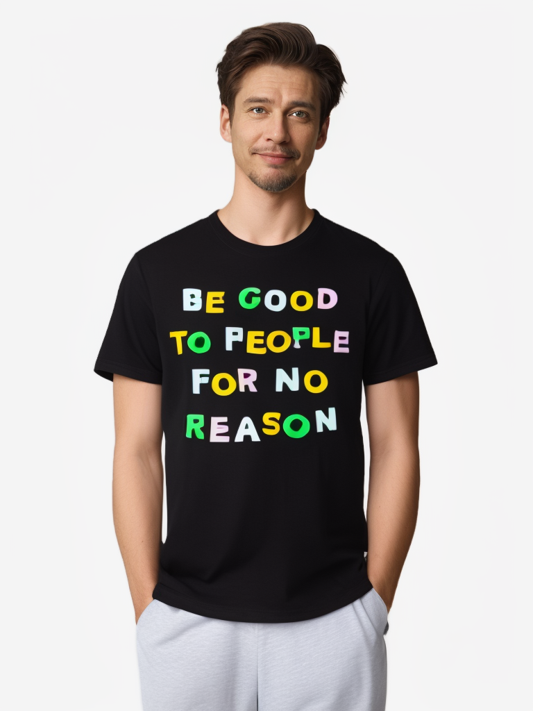 Flatlay of black graphic tee with colorful slogan 