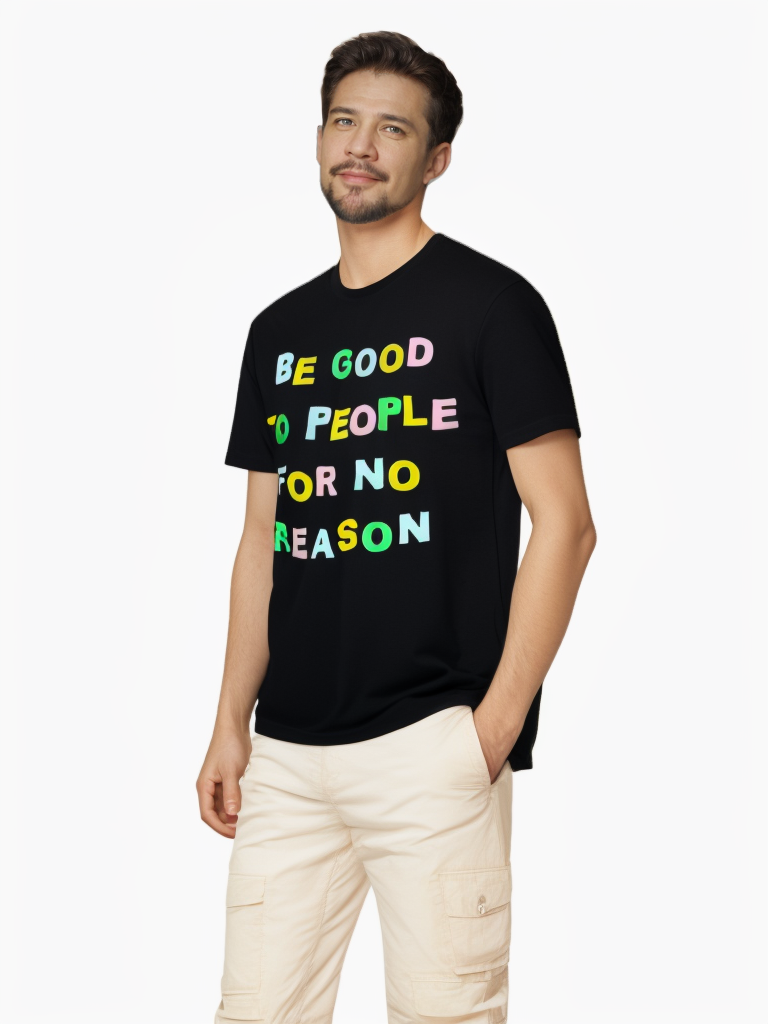 Side view of model wearing black graphic tee with colorful slogan 