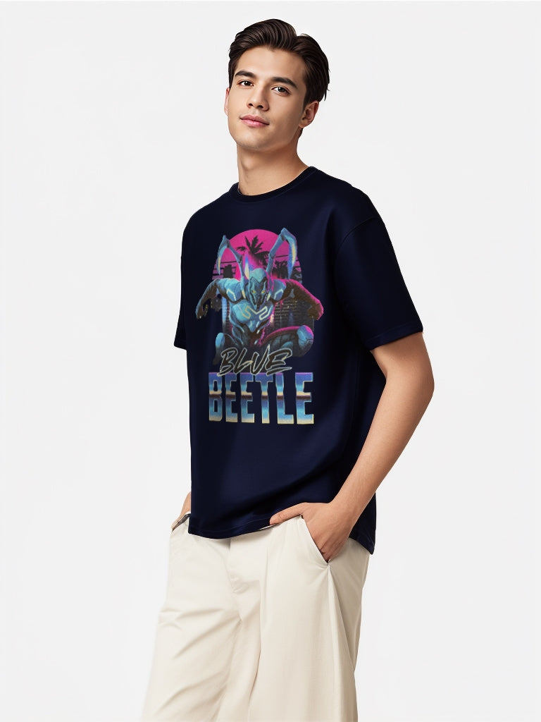 Side view of model in DC Blue Beetle tee with vibrant superhero print