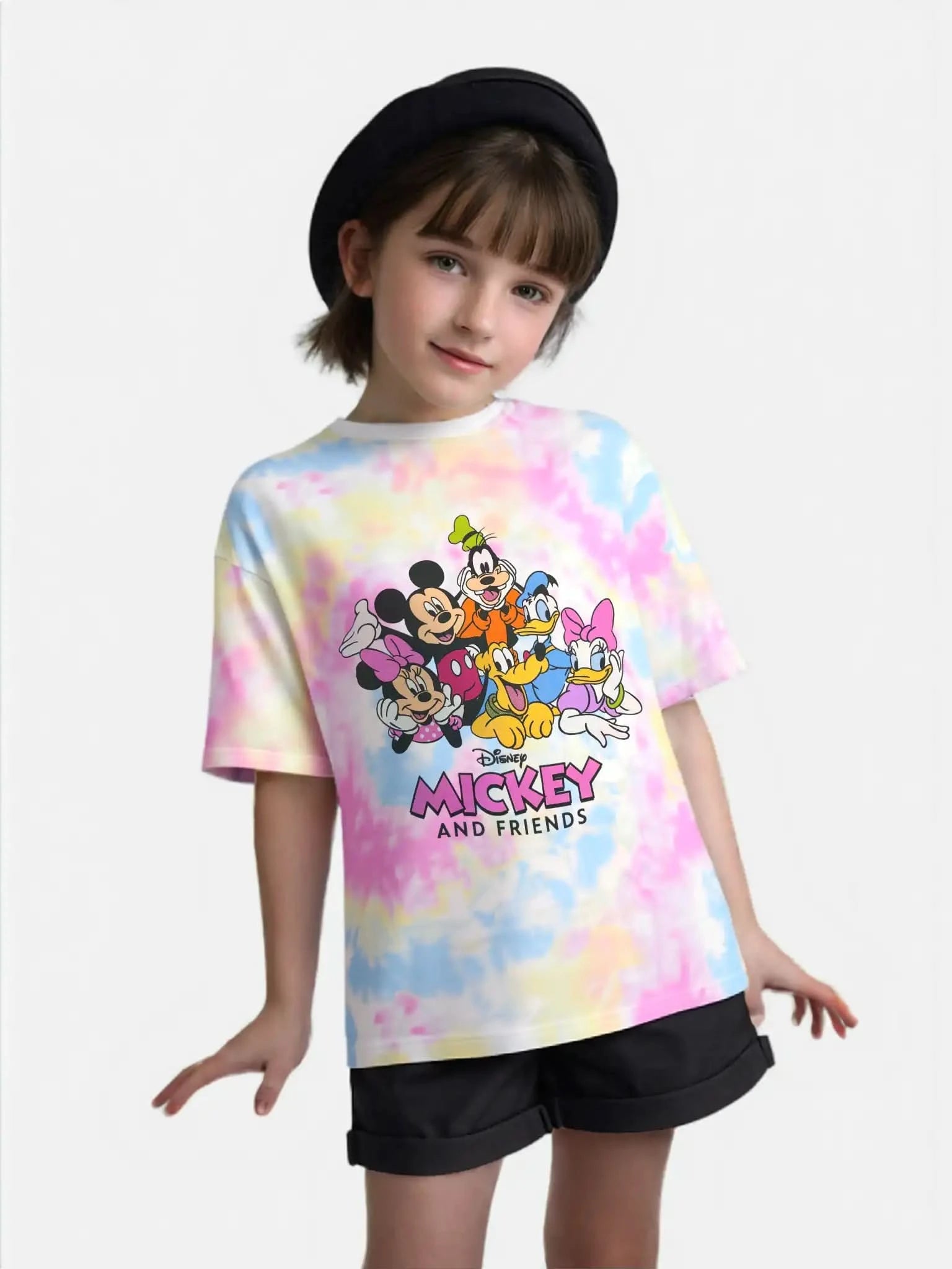 Girl posing in Disney Mickey & Friends pastel tie-dye graphic tee — featuring Minnie, Mickey, Donald, Goofy, Daisy, and Pluto. Ideal for girls' cartoon fashion and playful styling.