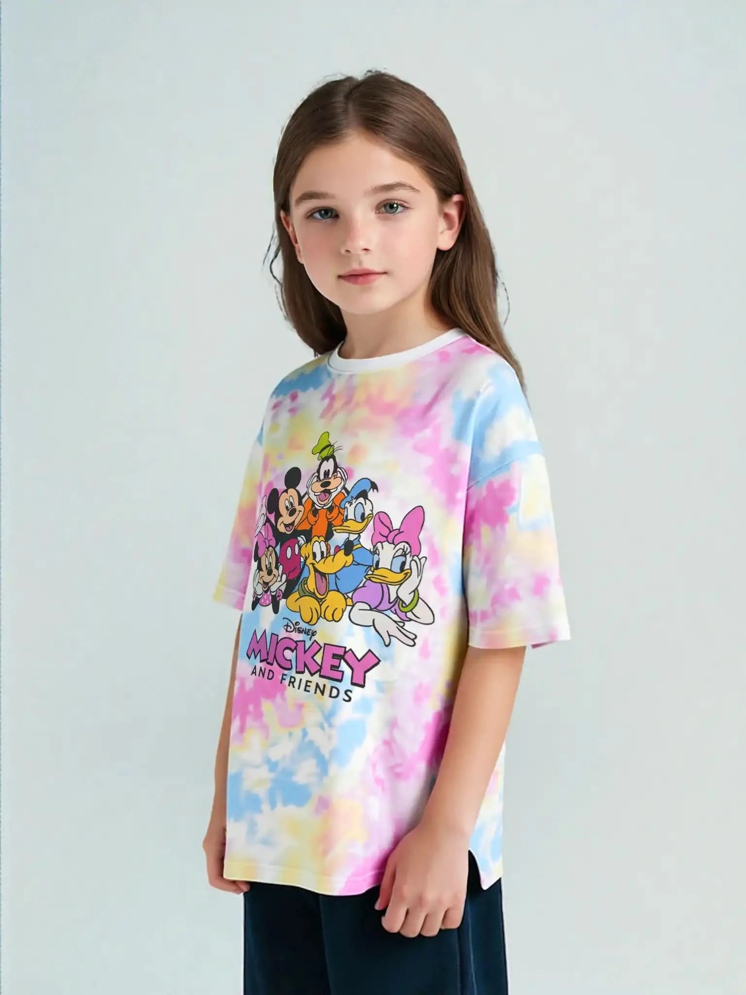 Girl model wearing Disney Mickey & Friends pastel tie-dye graphic tee — features Mickey, Minnie, Donald, Daisy, Goofy, and Pluto. Perfect for girls who love colorful cartoon shirts.