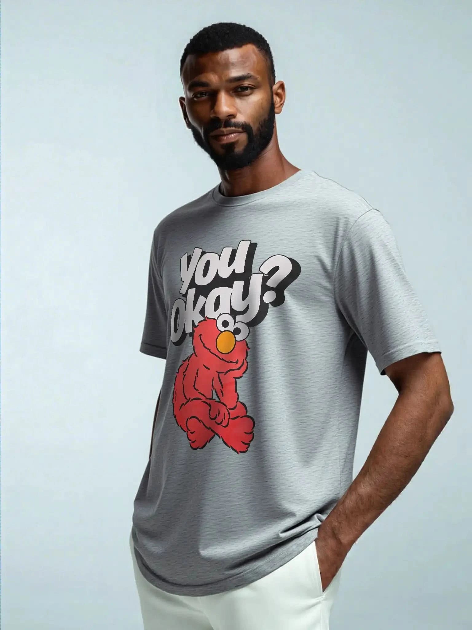 Model wearing Elmo “You Okay?” funny slogan graphic tee in heather gray – licensed Sesame Street™ men’s pop culture t-shirt.