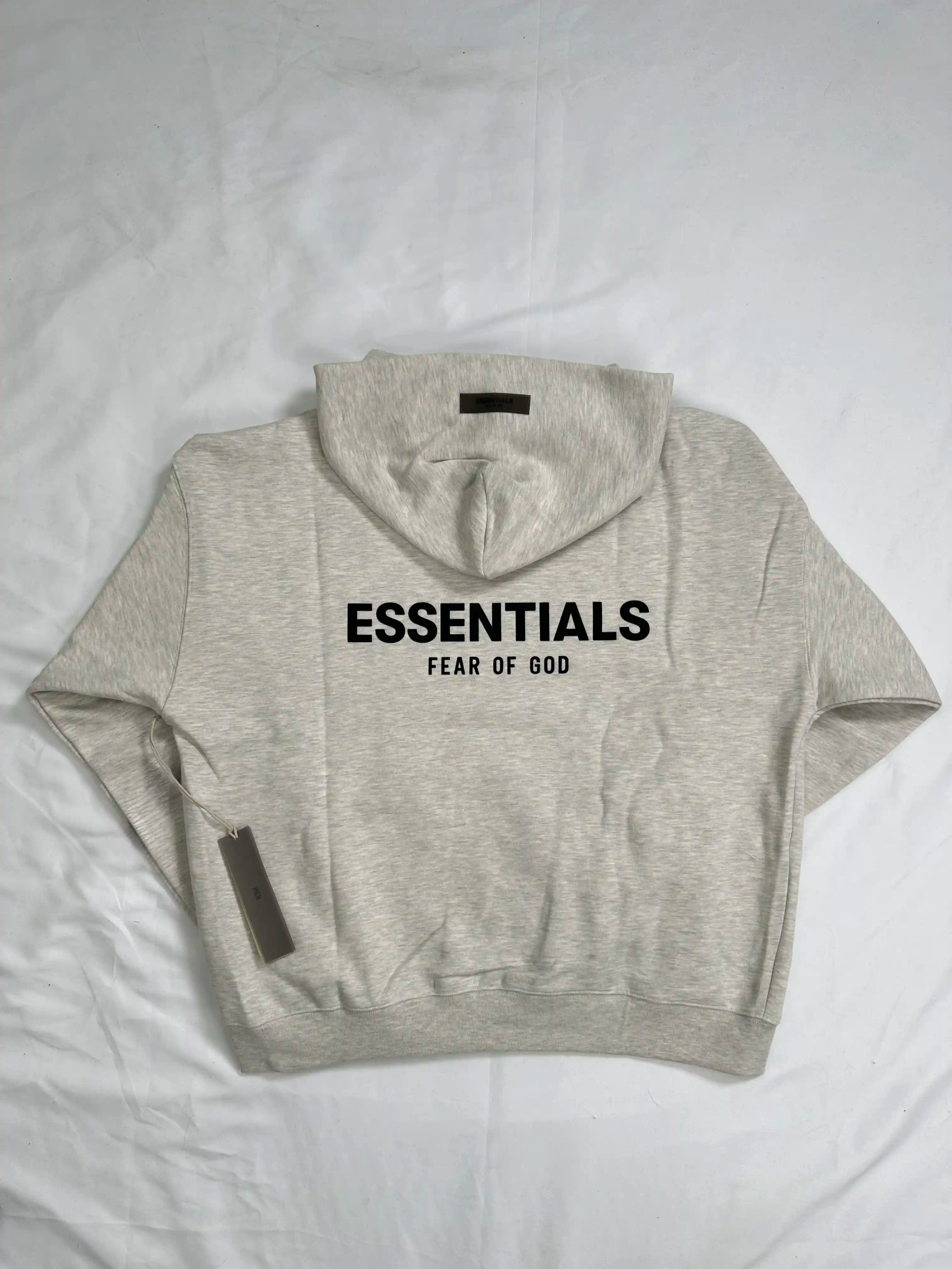 ESSENTIALS 2022 fleece hoodie in Light Oatmeal, back view with large ESSENTIALS logo