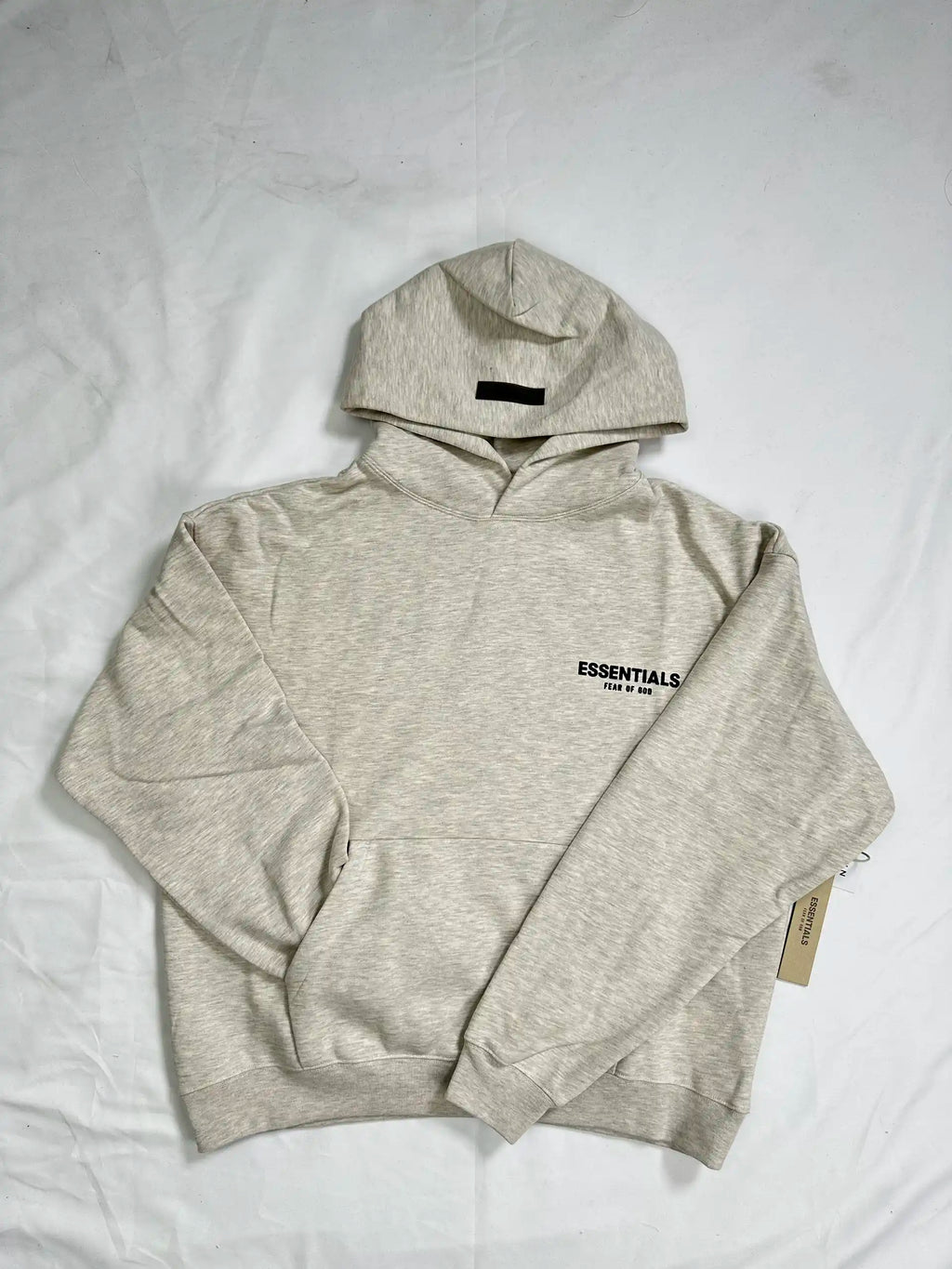 ESSENTIALS 2022 fleece hoodie in Light Oatmeal, front view, relaxed oversized fit, chest logo