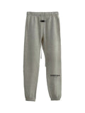 ESSENTIALS 2022 fleece jogger sweatpants in light oatmeal colorway, elastic cuff design, front view