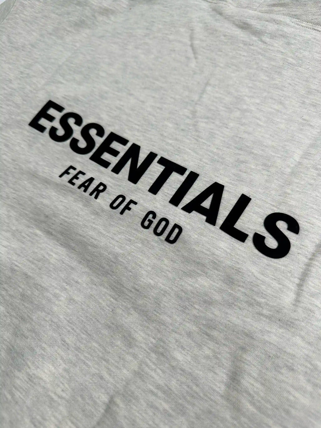 Back logo print detail on light oatmeal essentials fleece hoodie