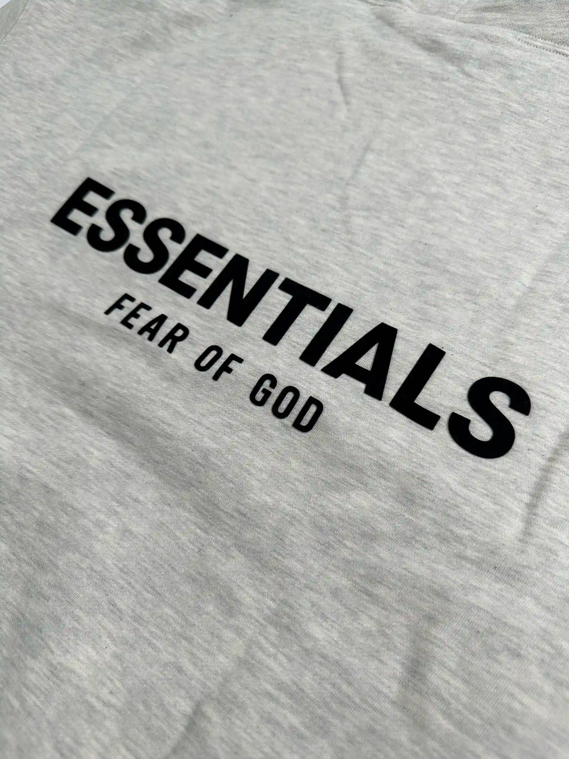 Back logo print detail on light oatmeal essentials fleece hoodie