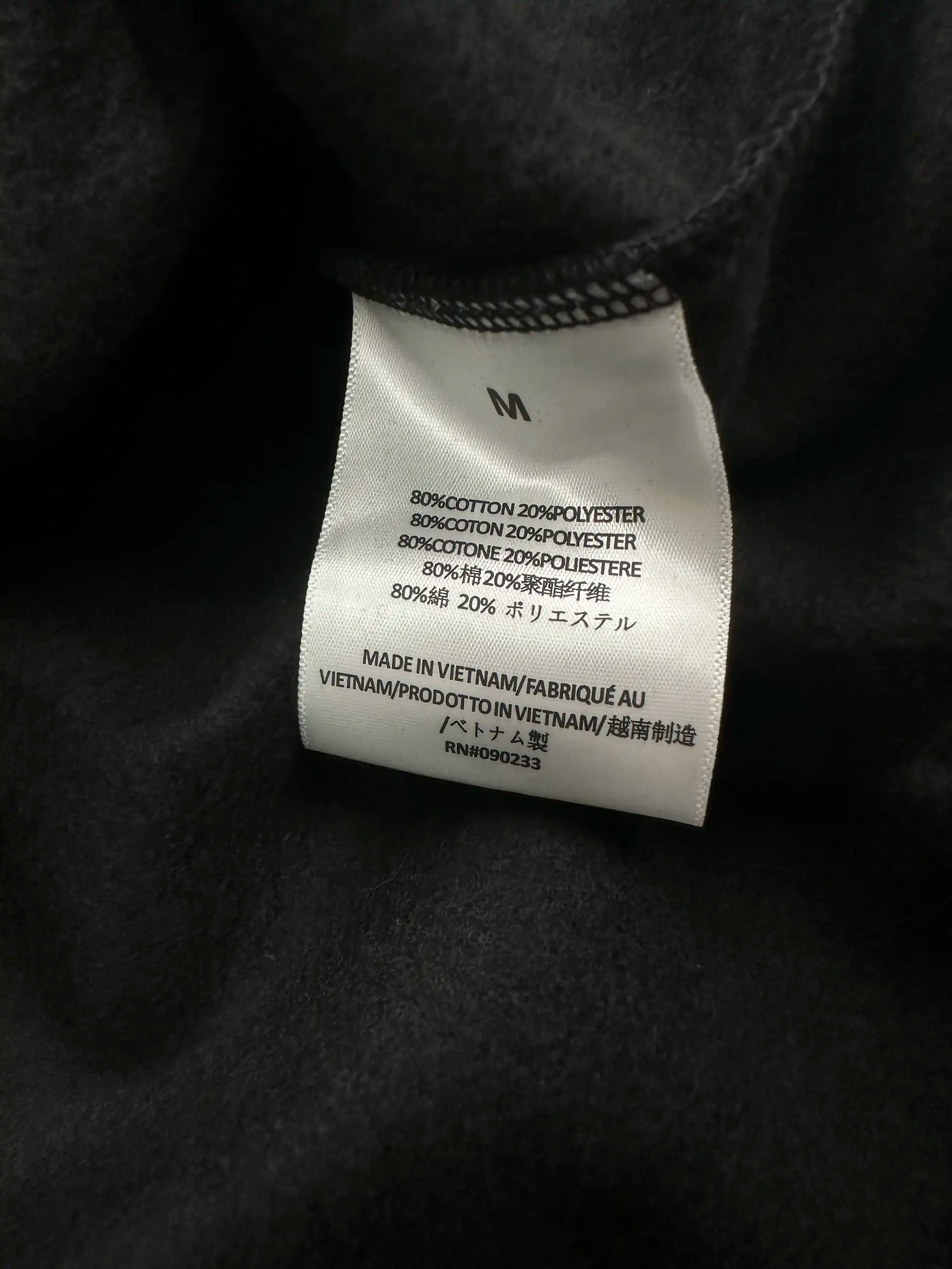 Fear of God Essentials hoodie material and size label made in Vietnam