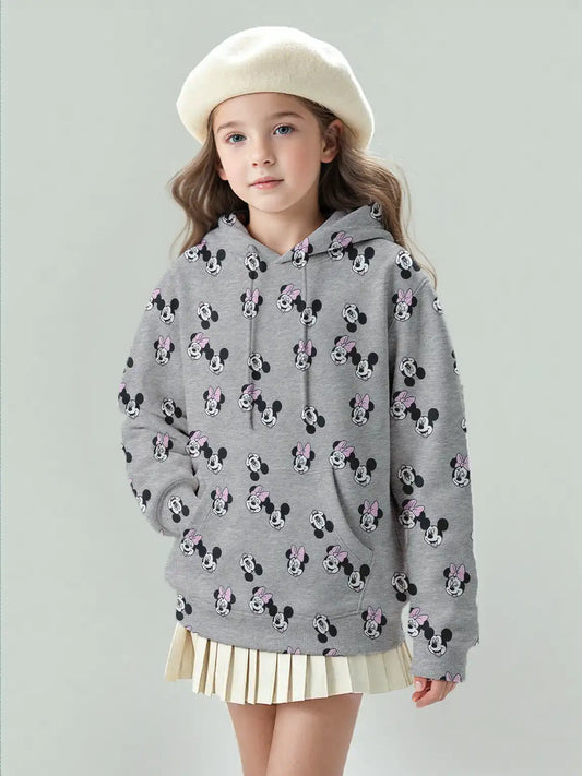 Girl model wearing Disney Mickey & Minnie gray hoodie in big girl size, all-over cartoon print.