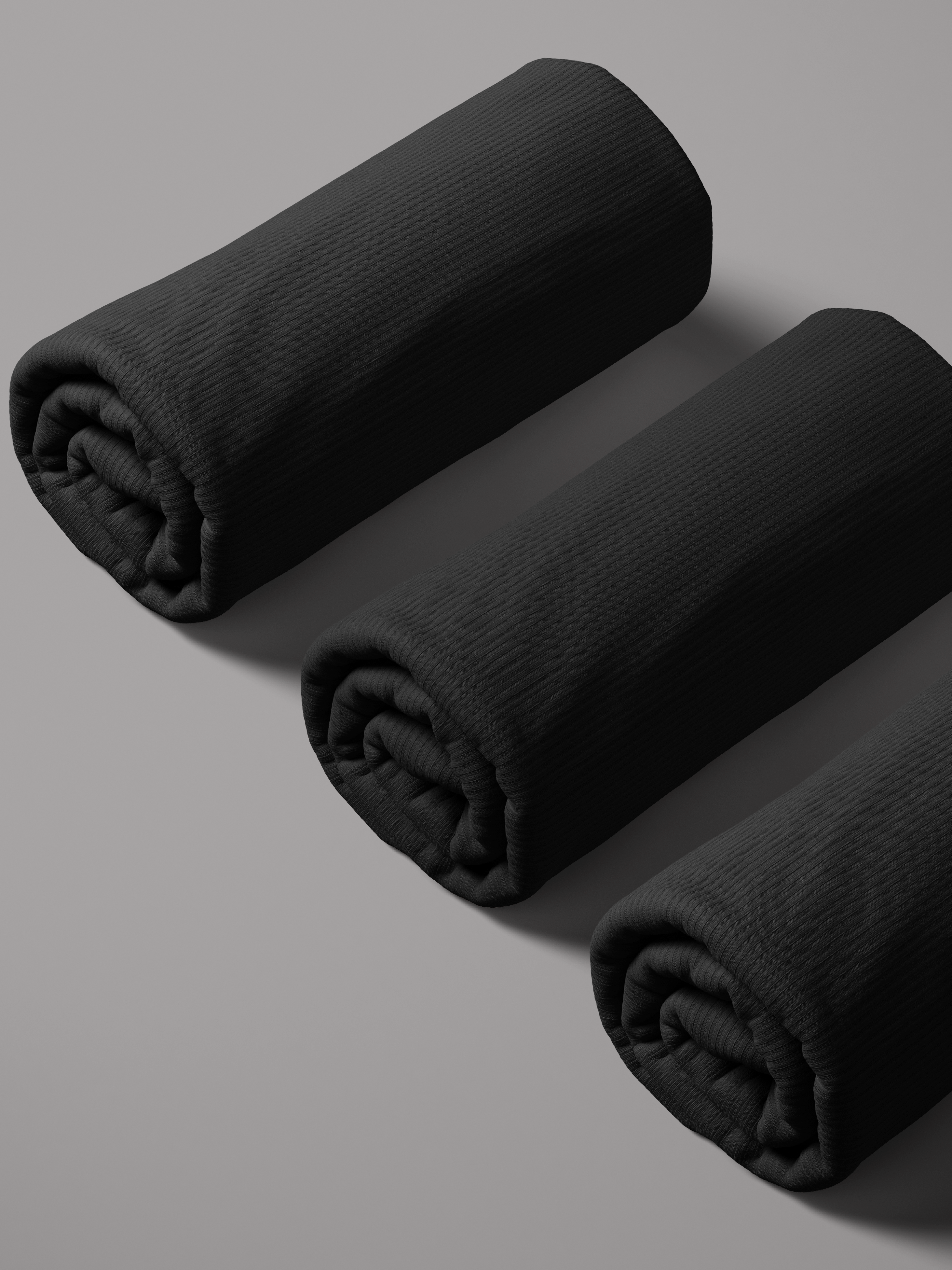 Close-up fabric detail of black graphic tee, showcasing soft, breathable cotton texture.