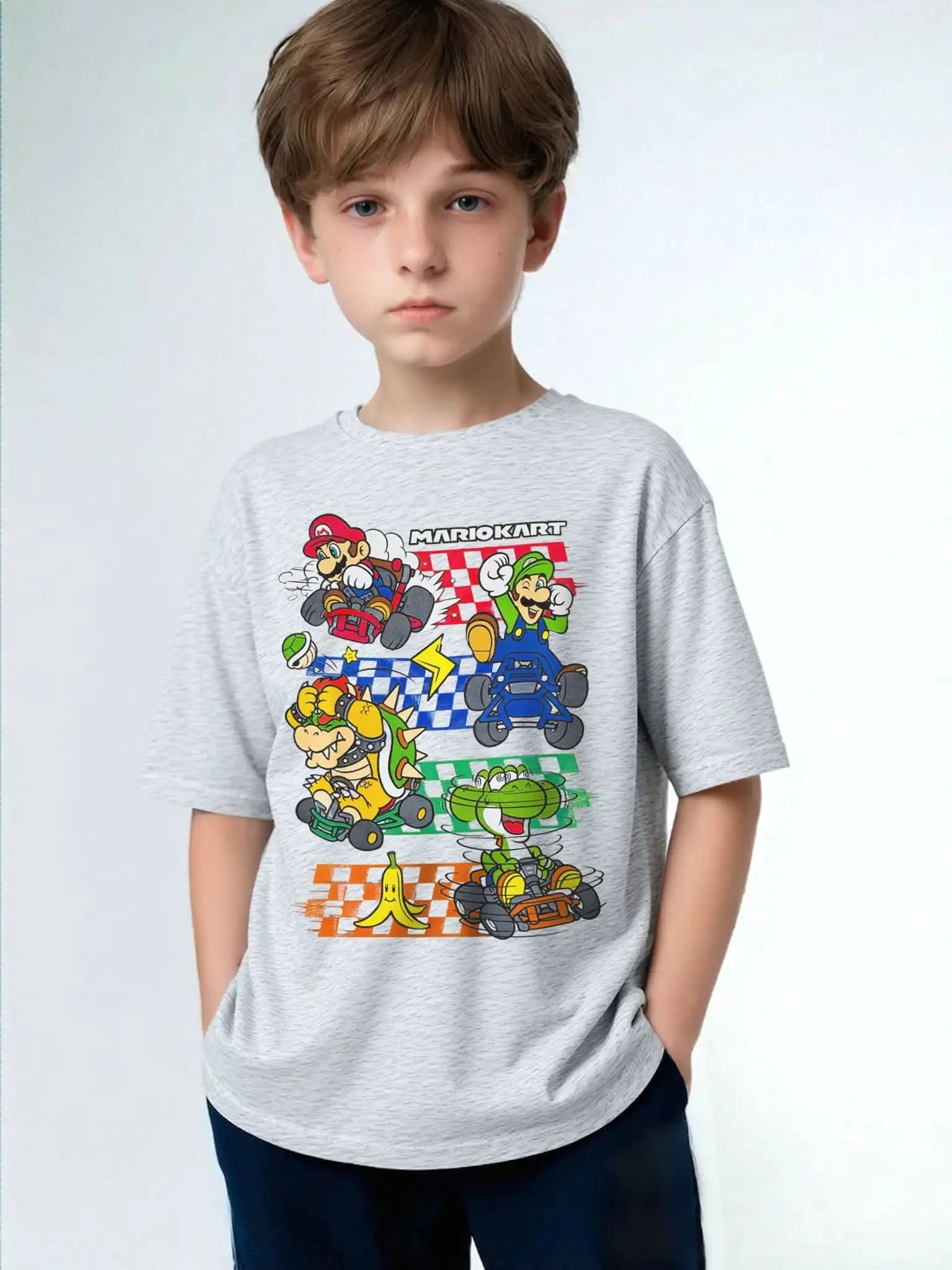 Child wearing Mario Kart™ licensed character t-shirt in heather gray featuring Mario, Luigi, Bowser, and Yoshi – soft cotton graphic tee for kids.
