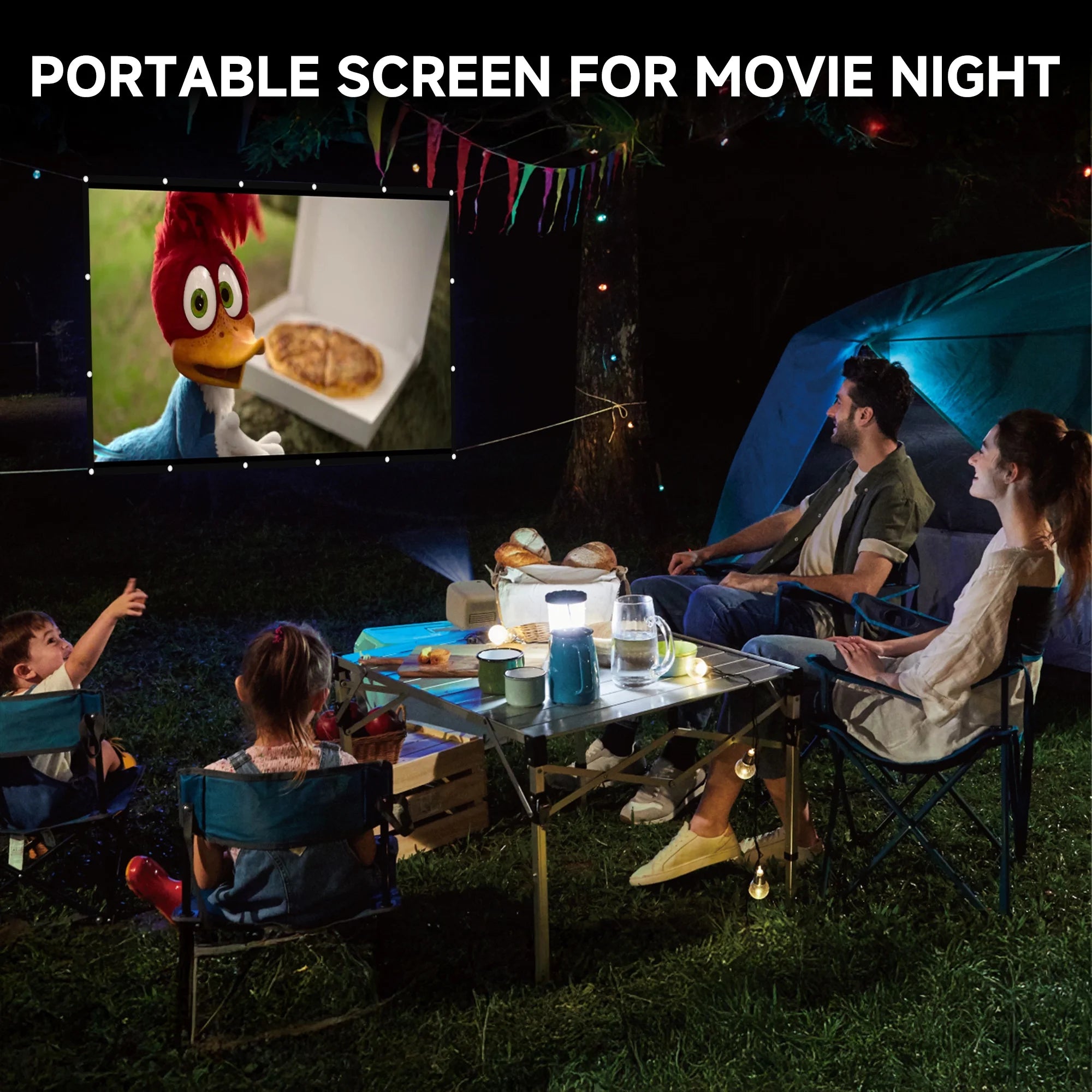 Family enjoying movie night outdoors using a portable projector screen while camping
