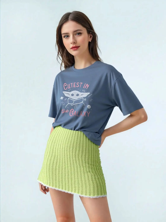 Front view of woman wearing Star Wars™ Grogu slogan t-shirt with “Cutest in the Galaxy” print, unisex navy cotton tee.
