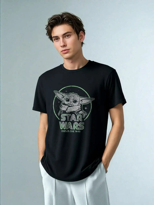 Model wearing Star Wars Grogu big fit black graphic tee with “This is the Way” slogan. Unisex pop culture t-shirt for young men and adult fans.