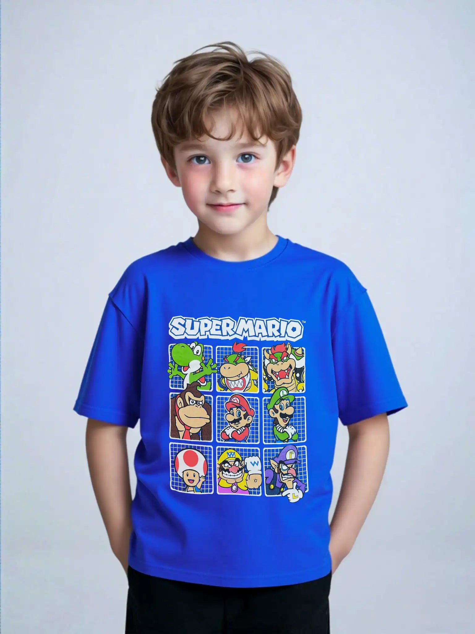 Young boy wearing Super Mario™ blue t-shirt with Nintendo characters grid design, 100% cotton kids and teen unisex fit.