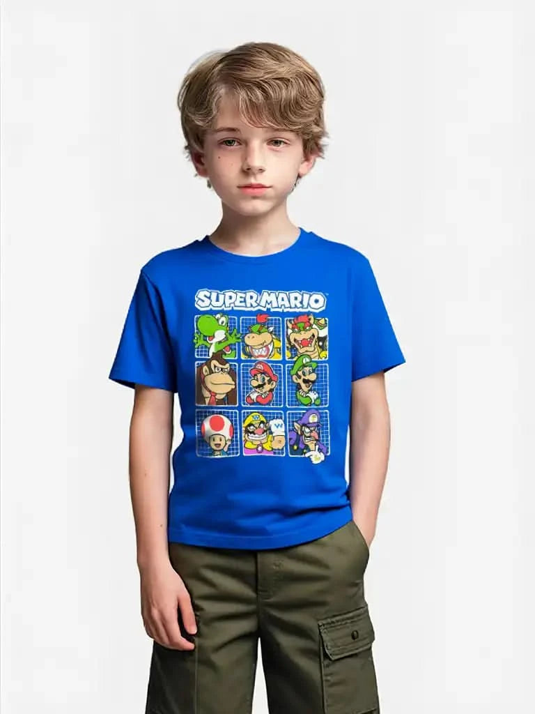 Boy modeling Super Mario™ blue t-shirt with colorful Nintendo characters print, standing with hands in pockets, 100% cotton.