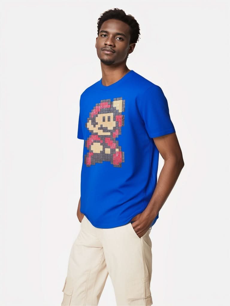 Male model wearing Super Mario Bros. 3 blue graphic T-shirt in pixel art style, side pose.