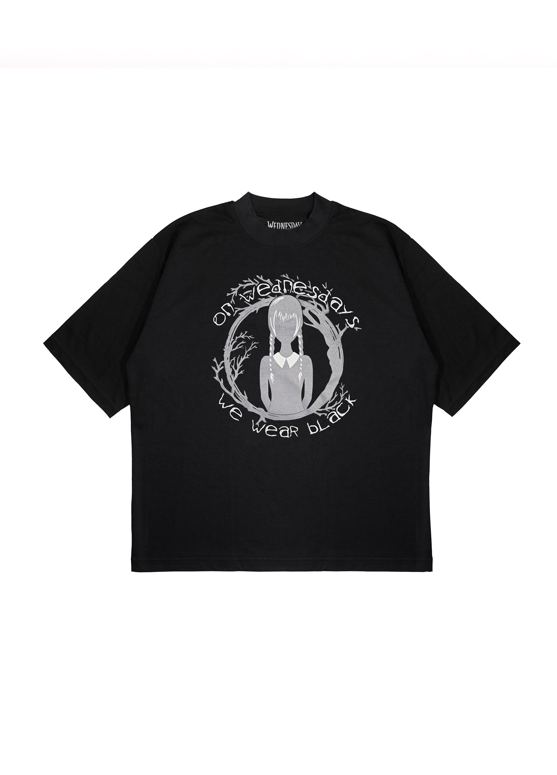 Flatlay of black graphic t-shirt with 'On Wednesdays We Wear Black' text and Wednesday Addams silhouette